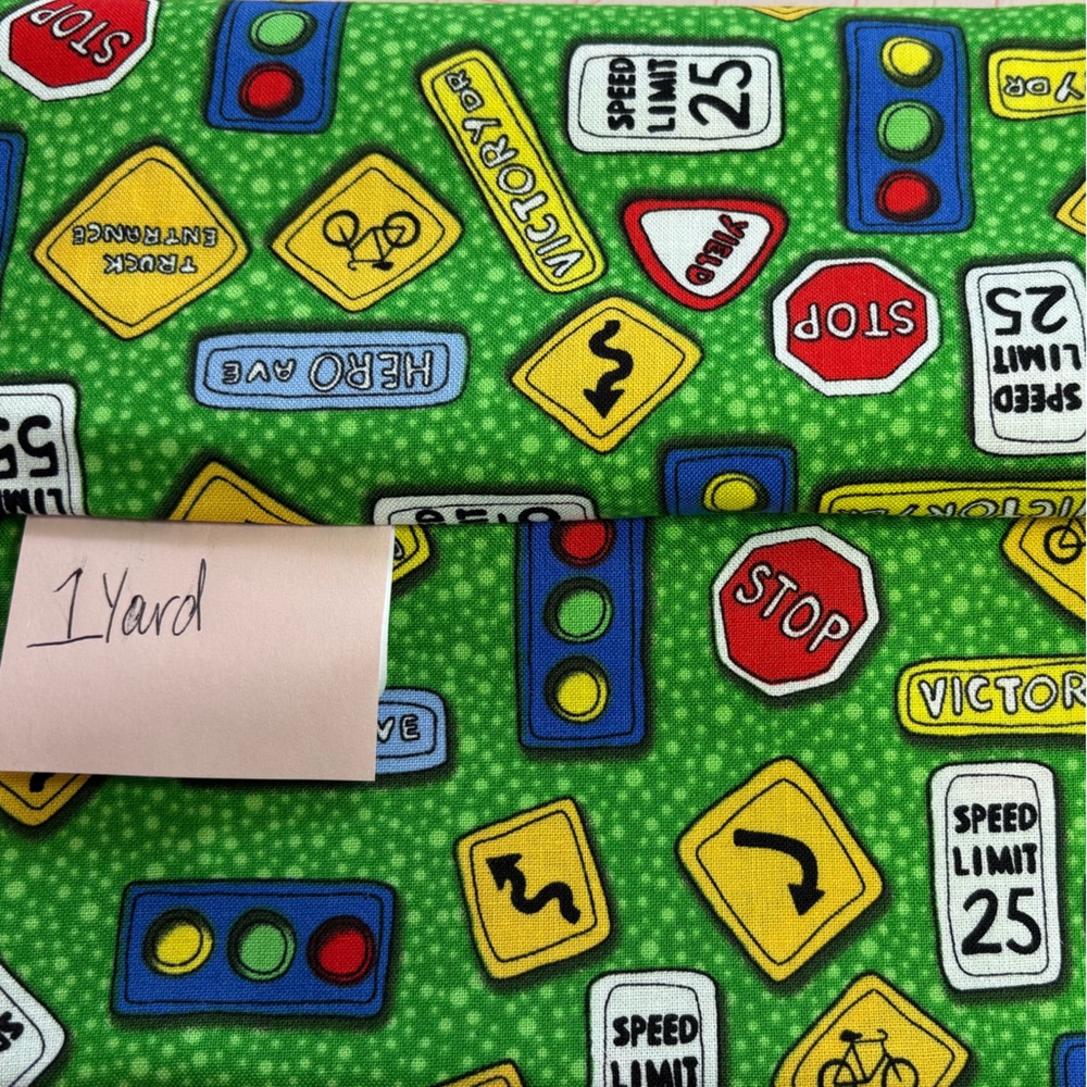My Little Town - 1 Yard Cut - 100% Cotton Green with colorful street signs